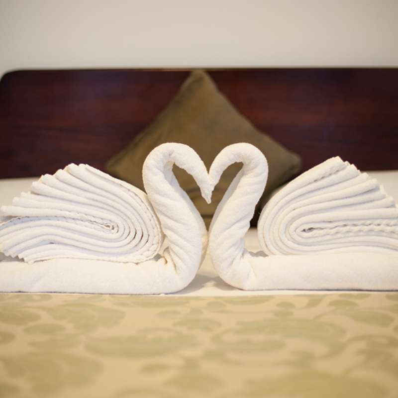Towel Swans in a Bedroom at Oak Ray Lake Resort in Tissamaharama