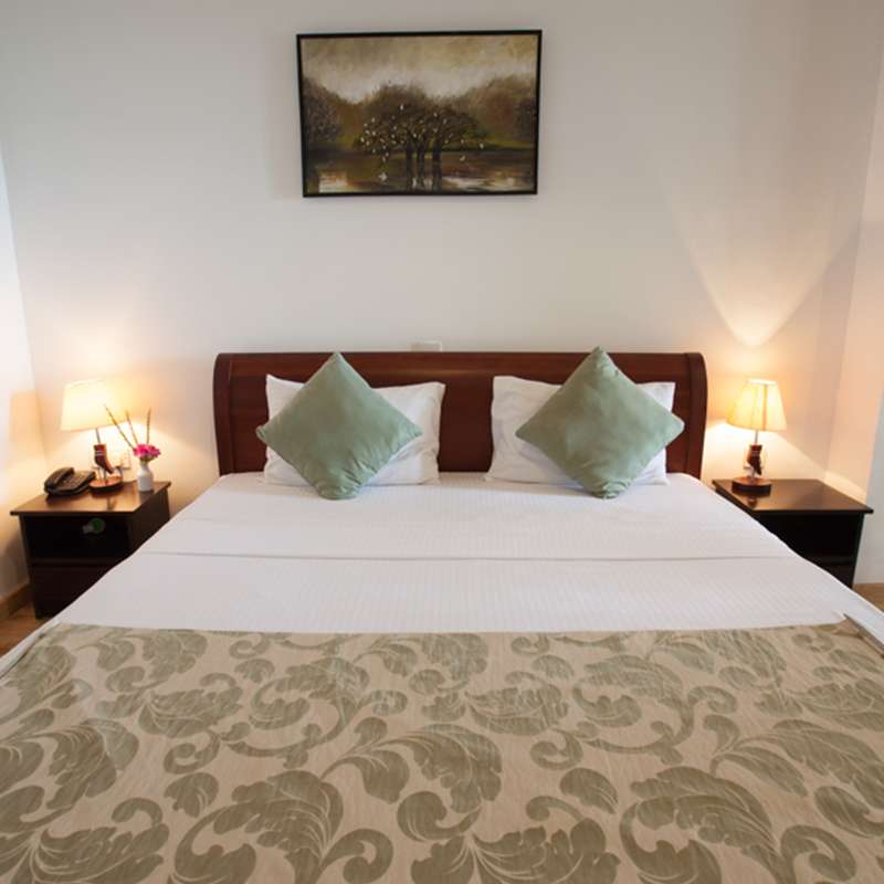 Bedding of a Room in Oak Ray Lake Resort Tissamaharama