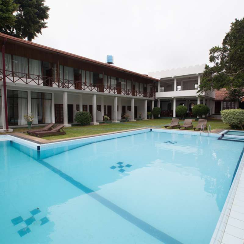 View of the Hotel from the Pool at Oak Ray Lake Resort Tissamaharama