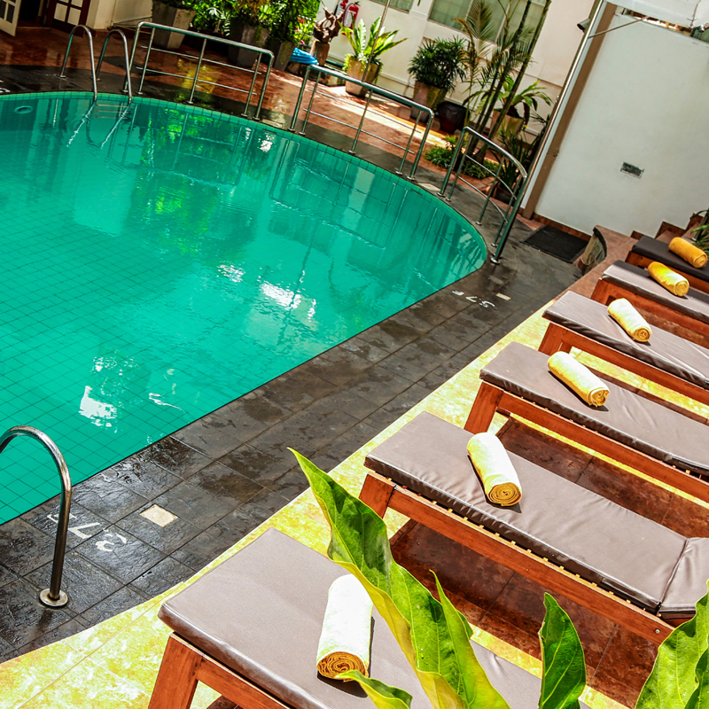 Swimming Pool with Sun Bathing Area